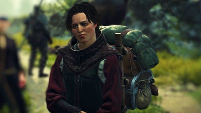 Dragon's Dogma 2 character with short hair and a red long-sleeved outfit wearing a big backpack